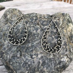 Silver teardrop shaped drop earrings.